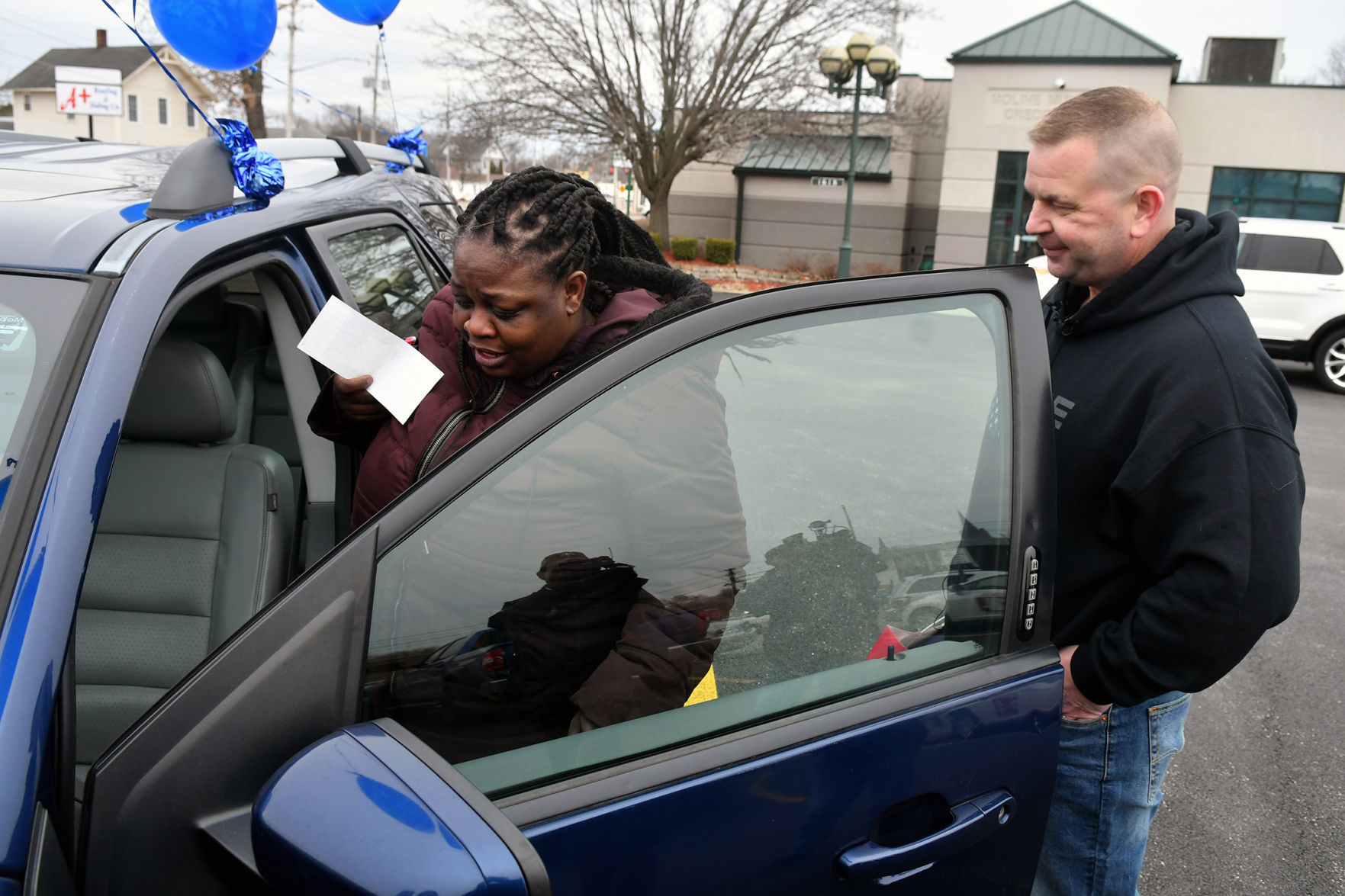 Moline police and Moline Municipal Credit Union give car away